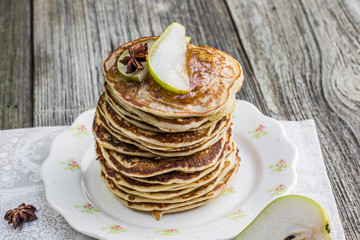 Whole grain pancakes with pear jam and a slice of pear and star
