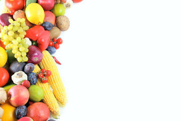 Ripe and tasty fruits and vegetables on a white background