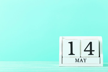 Cube calendar on mint wooden table