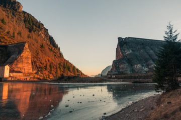 Naklejka premium Diga del Gleno abandoned dam and iced lake on the mountains of Italy