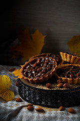 Autumn delicious cakes with nuts on plate.