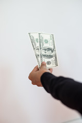  Man hand with money isolated on a white background.
