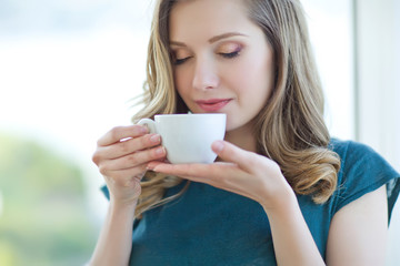 Beautiful woman drinking coffee 