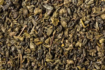 Fototapeta premium Dried leaves of green gunpowder tea, full frame.
