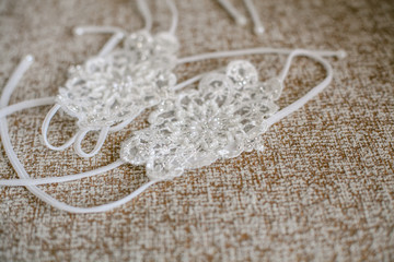 Delicate detail of a wedding dress. Fine lace.