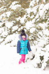 Fototapeta na wymiar Portrait of a Girl in the winter forest