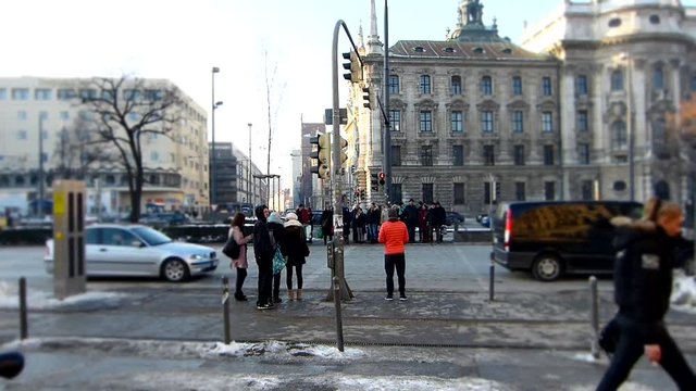 People and traffic on the crowded Karlsplatz / Stachus in Munich (time lapse tilt shift)