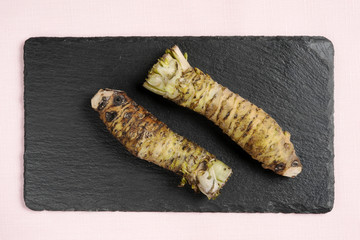 Fresh wasabi plants on slate plate