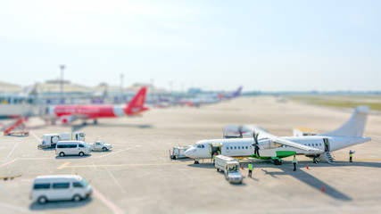 Obraz na płótnie Canvas Airport aporn and planes. Tlit shift effect.