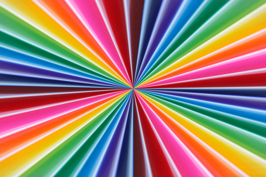 Background of colorful radial rays going from the center. Soft f