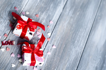 Gift box with hearts on wooden table for Valentines day