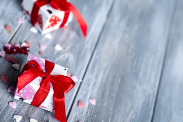 Gift box with hearts on wooden table for Valentines day