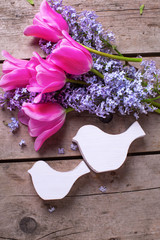 Two decorative birds  and  lilac andtulips flowers  on vintage w