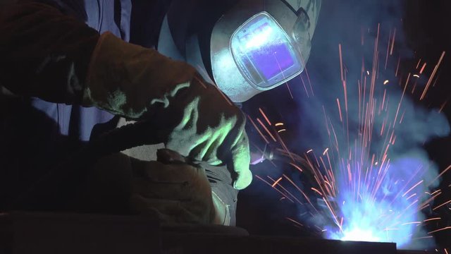 4k, Industrial steel welder in factory working