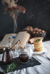 breakfast. coffee with cream and cheese cakes with sesame