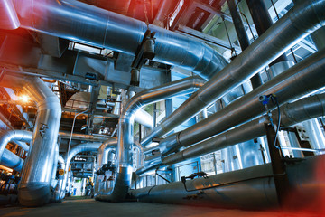 equipment, cables and piping as found inside of a modern industr