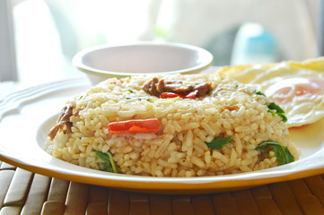 spicy fried rice pork and basil leaf topping fried egg with chili fish sauce