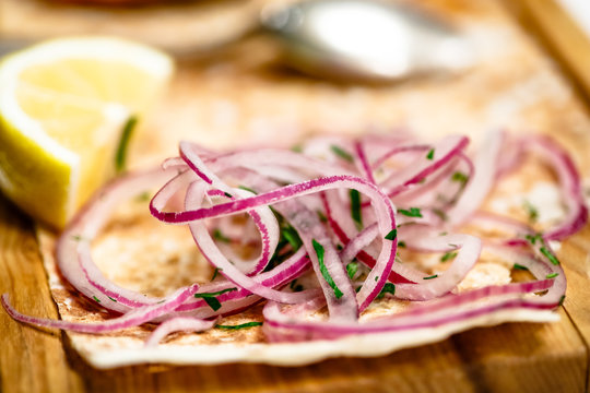 Pickled red onions sliced into thin rings - a traditional side d