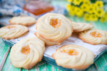 Home-made cookies of kurabie with apricot jam
