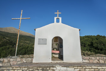Fototapeta premium Small church with blue roof on a Albanian beach