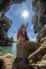 woman tourist enjoy in cave at island