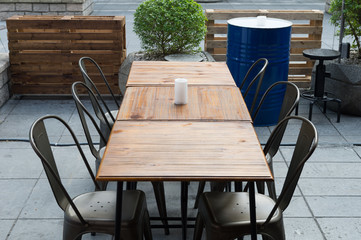 Selective focus of table of coffee shop outside view 