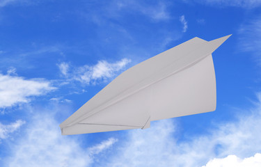 Fototapeta na wymiar Paper Airplane Flying in the Air.