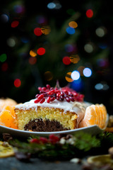 Fototapeta na wymiar Tangerine cake with chocolate by New year 