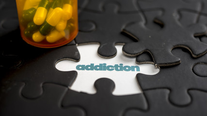 Word addiction under jigsaw puzzle piece