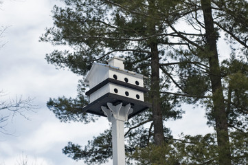 White painted wooden two storey bird house