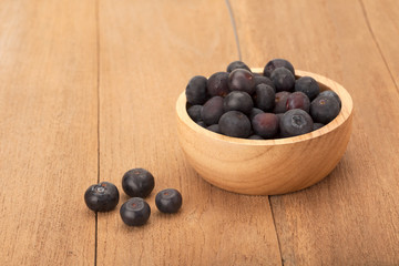 blueberry in wooden bowl
