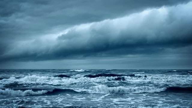 Stormy Rough Sea before Thunder. Cold Gray Ocean. Dramatic Dark Sky with Thundery Clouds. Epic Storm Cloudscape. Wild Nature Concept.