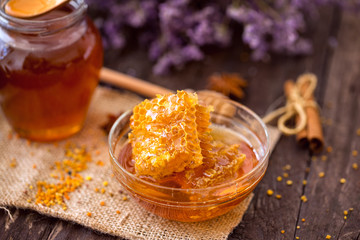 natural sweet honeycombs with pollen and honey on table.