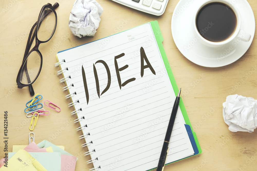 Poster idea text writeen on notebook