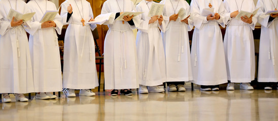 many children with the white tunic during the ceremony of the fi