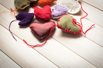 Valentine's Day. Colorful knitted hearts. Valentines day. Heart pendant. Red heart. Handmade Hearts. Valentine cards. Space for text.