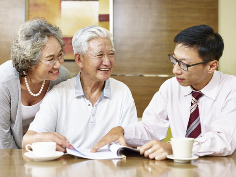 senior asian couple meeting a sales rep