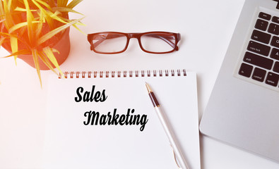 Notebook writing Sales Marketing,modern Office table with laptop