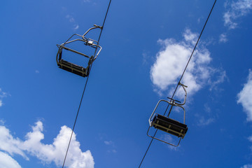 Empty ski lift with blue sky