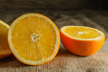 Oranges Fruits and Orange Slice on Wooden Table and Retro Fabric