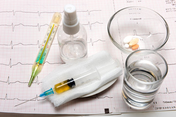 medicine, cardiograms and pills to fight disease