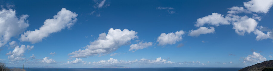 Naklejka na ściany i meble Clear sky panorame with clouds