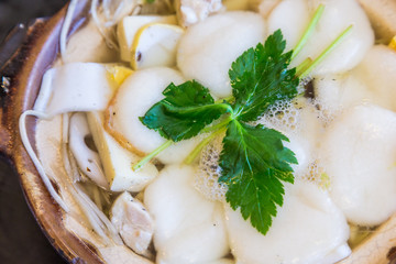 Traditional Shimabara Guzoni - soup with rice cake and seafood