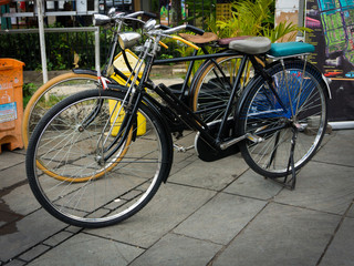 Fototapeta na wymiar Two classic bicycle parked in front of museum photo taken in Jakarta Indonesia