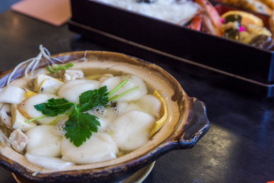 Traditional Shimabara Guzoni - soup with rice cake and seafood