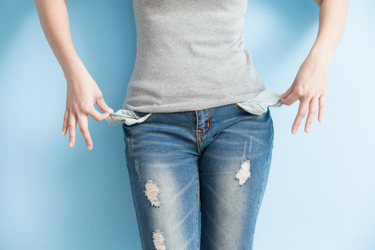 woman showing her empty pockets