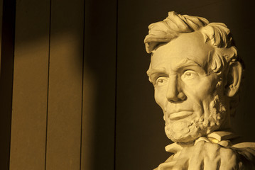 Statue of Abraham Lincoln in brilliant warm dramatic morning sunlight