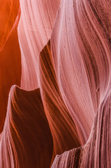 Pink peach wave shapes photographed at slots canyons in Arizona.