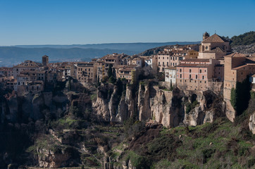 View to hanging houses "casas colgadas" of Cuenca old town.Example of a medieval city, built on the steep sides of a mountain. Many casas colgadas are built right up to the cliff edge. Cuenca, Spain