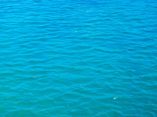 Fototapeta na wymiar Blue tranquil sea water background.